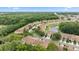 Ariel view of a community with lush green landscaping surrounding each property at 4149 Winding River Way, Land O Lakes, FL 34639