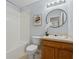 Well-maintained bathroom with a combination tub and shower featuring updated fixtures at 4149 Winding River Way, Land O Lakes, FL 34639