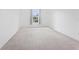 Bright, carpeted bedroom featuring a window and closet for storage solutions at 4149 Winding River Way, Land O Lakes, FL 34639