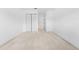 Spacious bedroom with neutral carpet, ample closet space, and a minimalist design at 4149 Winding River Way, Land O Lakes, FL 34639