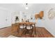 Bright dining room with hardwood floors and eat-in kitchen nearby at 4149 Winding River Way, Land O Lakes, FL 34639