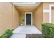 Inviting front entrance with a black door and manicured landscaping at 4149 Winding River Way, Land O Lakes, FL 34639