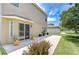 Spacious backyard patio with views of the manicured lawn at 4227 Bethpage Ct, Wesley Chapel, FL 33543