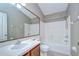 Bright bathroom featuring a shower and bathtub combination, a spacious vanity, and neutral colors at 4227 Bethpage Ct, Wesley Chapel, FL 33543