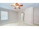 Light and airy bedroom with neutral walls and a ceiling fan for added comfort at 4227 Bethpage Ct, Wesley Chapel, FL 33543