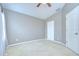 The bedroom features a ceiling fan and ample natural light, offering a calm ambiance at 4227 Bethpage Ct, Wesley Chapel, FL 33543