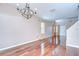 Spacious dining area boasts hardwood floors and a chandelier, perfect for Gathering meals at 4227 Bethpage Ct, Wesley Chapel, FL 33543