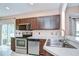 Bright kitchen features stainless steel appliances, ample counter space, and a breakfast bar at 4227 Bethpage Ct, Wesley Chapel, FL 33543
