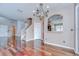 Open-concept living area showcases hardwood floors, natural light, and an inviting staircase at 4227 Bethpage Ct, Wesley Chapel, FL 33543