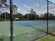 Outdoor tennis courts in a fenced-in area at the community recreation facilities at 4227 Bethpage Ct, Wesley Chapel, FL 33543
