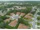An aerial view of a residential community with manicured lawns and landscaping at 4228 Silver Star Dr, Spring Hill, FL 34609