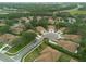 An aerial view of a residential community with manicured lawns and landscaping at 4228 Silver Star Dr, Spring Hill, FL 34609