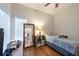 Cozy bedroom with a full-length mirror, natural light, and wood floors, creating a peaceful atmosphere at 4228 Silver Star Dr, Spring Hill, FL 34609