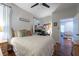 Bright bedroom with wooden floors, natural light, and a desk area, creating a warm and inviting space at 4228 Silver Star Dr, Spring Hill, FL 34609