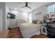 Relaxing bedroom with a queen bed, natural light, and hardwood floors at 4228 Silver Star Dr, Spring Hill, FL 34609