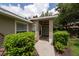 Inviting home entrance framed by lush landscaping and a well-manicured lawn at 4228 Silver Star Dr, Spring Hill, FL 34609