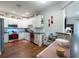 Bright kitchen features white cabinetry, stainless steel appliances, and an adjacent breakfast bar at 4228 Silver Star Dr, Spring Hill, FL 34609