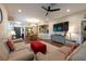 Spacious living room with hardwood floors, ceiling fan, tv and dining area at 4228 Silver Star Dr, Spring Hill, FL 34609