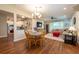Open-concept living area with hardwood floors, modern lighting, and stylish furnishings at 4228 Silver Star Dr, Spring Hill, FL 34609