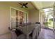 Screened in patio boasts a large glass table with room to seat 10 guests at 4228 Silver Star Dr, Spring Hill, FL 34609