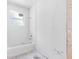 An unfinished bathroom featuring a tub and shower, ready for fixtures and finishes at 4261 Burns Rd, Brooksville, FL 34602