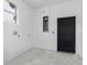 The garage has a window, electrical panel, and a black door at 4261 Burns Rd, Brooksville, FL 34602