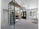 An unfinished living room shows a fireplace, large windows, and scaffolding; ready for personalization at 4261 Burns Rd, Brooksville, FL 34602