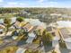 Aerial view showcasing the home's location near a lake and surrounding community at 4411 Whitton Way, New Port Richey, FL 34653