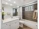 Comfortable bathroom featuring stylish fixtures, granite counters, and bathtub shower with curtain at 4411 Whitton Way, New Port Richey, FL 34653