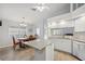 Updated kitchen featuring granite countertops, stainless steel appliances, and an adjacent dining area at 4411 Whitton Way, New Port Richey, FL 34653
