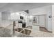 Open concept kitchen with granite counters, stainless appliances, island and breakfast nook at 4411 Whitton Way, New Port Richey, FL 34653