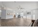 Bright living room features lots of space, wood-look floors, and natural light at 4411 Whitton Way, New Port Richey, FL 34653