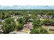 An aerial view of a house with trees with a red marker for location at 4425 Porpoise Dr, Tampa, FL 33617