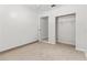Bedroom featuring neutral walls, carpet flooring, a ceiling fan, closet, and door to another room at 4425 Porpoise Dr, Tampa, FL 33617