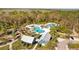 Aerial view of the community pool, showing multiple pools, lounge chairs, and ample space for relaxation and recreation at 4679 Emprise Way, Land O Lakes, FL 34638