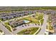 Aerial view showcases community pool, clubhouse, and Gathering-friendly green spaces, perfect for outdoor activities and social gatherings at 4679 Emprise Way, Land O Lakes, FL 34638