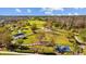 Scenic aerial view of the community park, featuring playgrounds, walking paths, and green spaces for recreation and leisure at 4679 Emprise Way, Land O Lakes, FL 34638