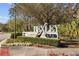 Community entrance sign for Bexley Club with decorative landscaping at 4679 Emprise Way, Land O Lakes, FL 34638
