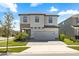 Charming two-story home featuring stone accents, neutral siding, paver driveway and a two-car garage at 4679 Emprise Way, Land O Lakes, FL 34638