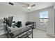 Home office featuring a modern desk setup and ample natural light from the large window at 4679 Emprise Way, Land O Lakes, FL 34638