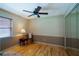 Bright bedroom features hardwood floors, a ceiling fan, and mirrored closet doors at 4783 Palermo Ne Ct # 4783, St Petersburg, FL 33703
