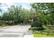 Landscaped entrance with signage for 'Placido Bayou' community at 4783 Palermo Ne Ct # 4783, St Petersburg, FL 33703