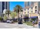 Street view of a commercial building with palm trees and blue awnings at 4783 Palermo Ne Ct # 4783, St Petersburg, FL 33703