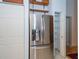 Stainless steel refrigerator with shelving and storage offers modern convenience in this kitchen space at 4783 Palermo Ne Ct # 4783, St Petersburg, FL 33703