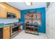 Charming kitchen boasting stainless steel appliances, colorful cabinets, and ample counter space at 4783 Palermo Ne Ct # 4783, St Petersburg, FL 33703