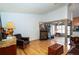 Comfortable living room with hardwood floors, ornate accents, and a view into the adjacent sunroom at 4783 Palermo Ne Ct # 4783, St Petersburg, FL 33703