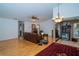 Spacious living room with hardwood floors, decorative fireplace, and lots of natural light at 4783 Palermo Ne Ct # 4783, St Petersburg, FL 33703