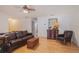 Well-lit living room featuring hardwood floors, comfortable seating, and traditional decor at 4783 Palermo Ne Ct # 4783, St Petersburg, FL 33703