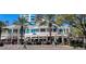 Street view of Cassis restaurant with outdoor seating and palm trees at 4783 Palermo Ne Ct # 4783, St Petersburg, FL 33703