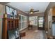 Bright sunroom with tiled floors, plantation shutters, and access to the backyard at 4783 Palermo Ne Ct # 4783, St Petersburg, FL 33703